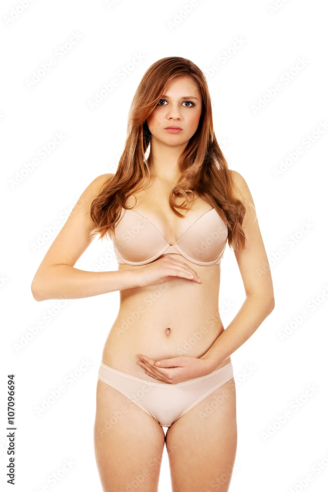 Young woman belly with hand on it Young woman belly with hand on it