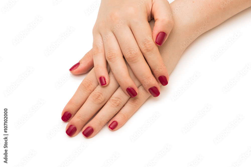 Woman hands with red nail isolated on white Woman hands with red nail isolated on white