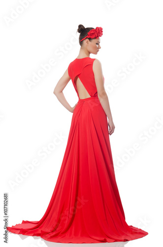 Pretty caucasian model in red long evening dress isolated on whi