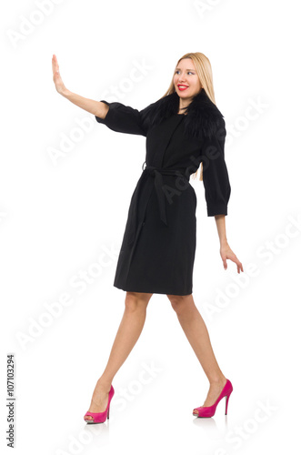 Pretty blond woman in black coat isolated on white