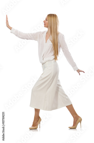 Blond hair model in elegant flared pants isolated on white