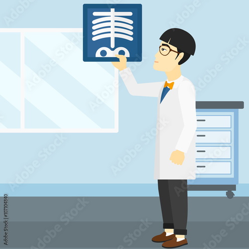 Doctor examining radiograph.