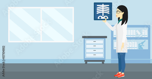 Doctor examining radiograph.