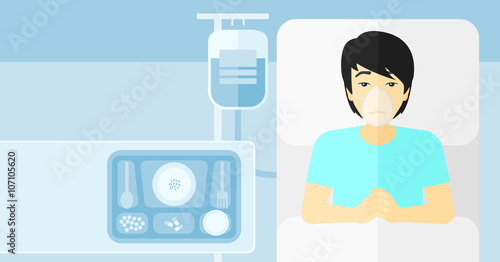 Patient lying in hospital bed.
