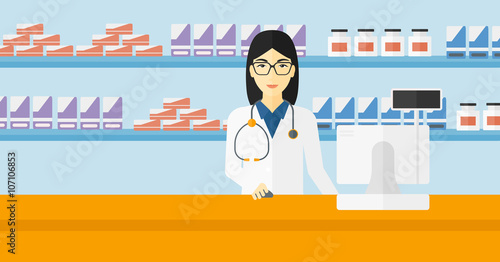Pharmacist at counter with computer monitor.