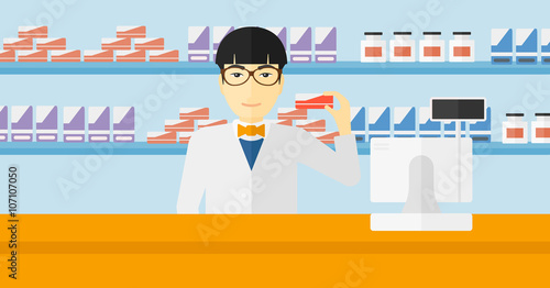 Pharmacist showing some medicine.