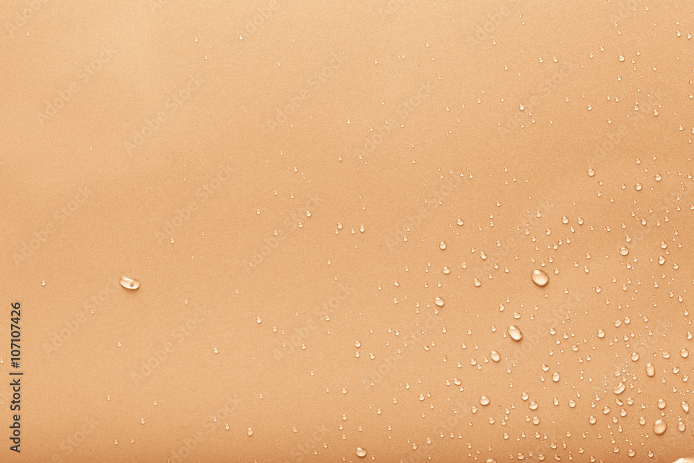 Dops of water on a color background. Yellow. Toned Dops of water on a color background. Yellow. Toned