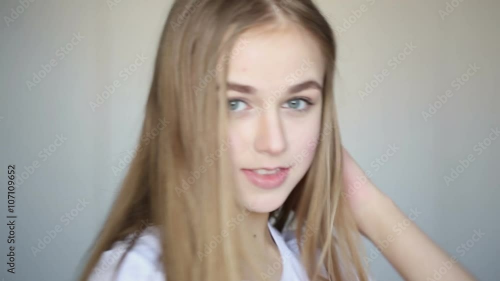 beautiful young girl posing in the studio on a white background beautiful young girl posing in the studio on a white background