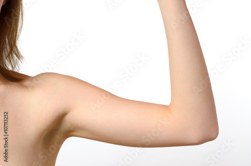 One woman bare shoulder and arm bent at the elbow photo