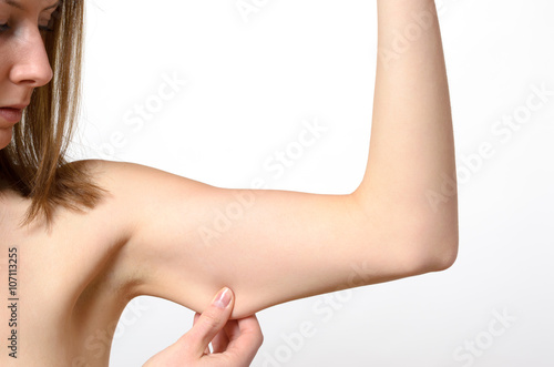 Fotografia Topless solitary woman pinching bare arm