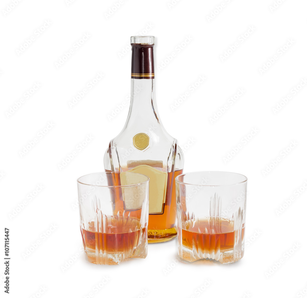 Bottle of whiskey and two glasses with whiskey Bottle of whiskey and two glasses with whiskey