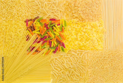 Background of several uncooked pasta different varieties photo