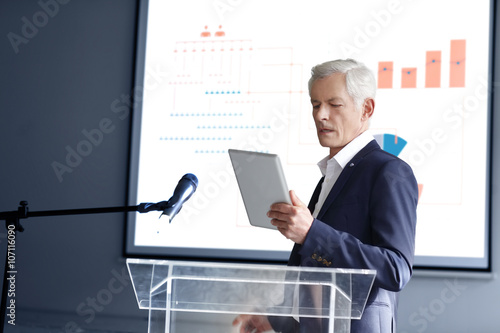 Senior businessman giving a speech