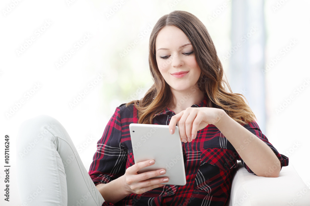 Relaxing with digital tablet Relaxing with digital tablet