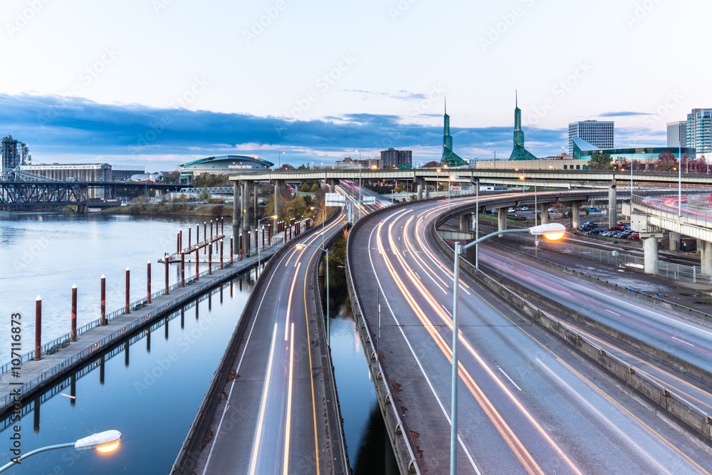 traffic on road with cityscape and skyline of portland traffic on road with cityscape and skyline of portland