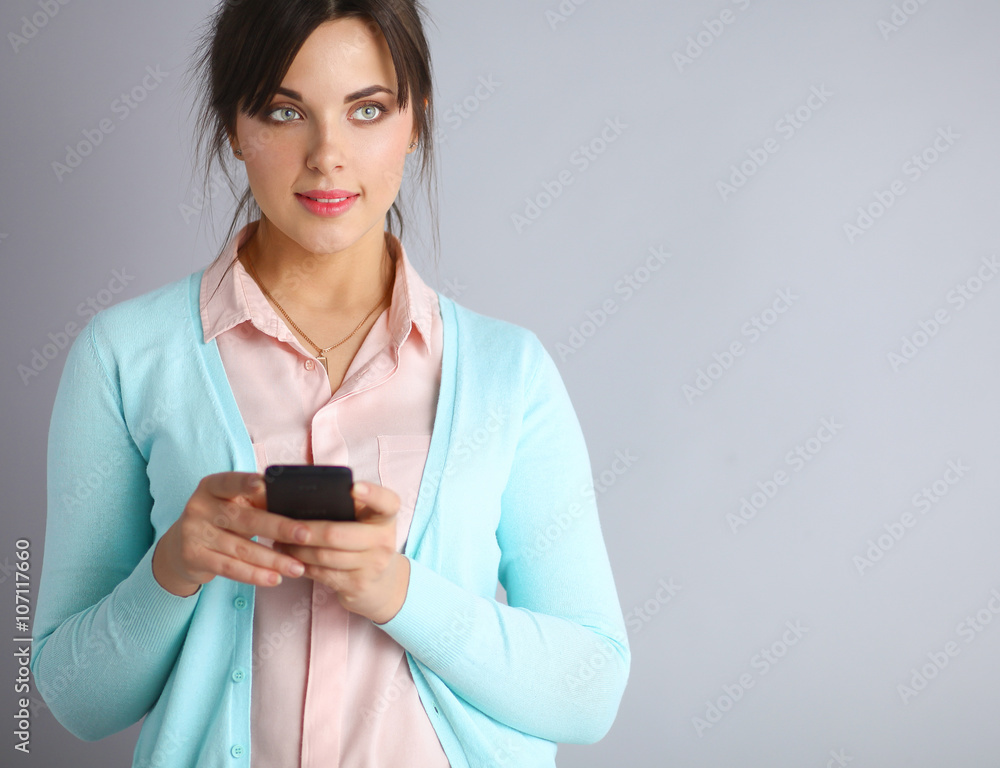 Woman using and reading a smart phone 