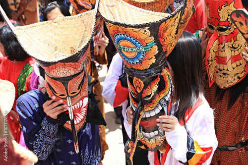 Phi Ta Khon Festival in Loei, Thailand. Young people dress in spirit and wear a mask, sing and dance 
