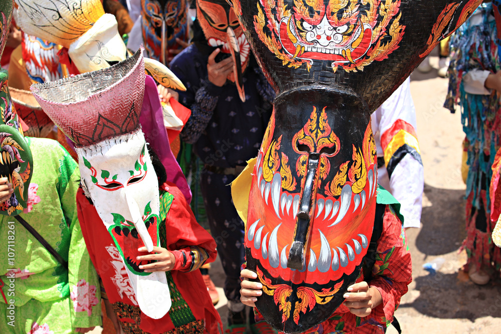 Phi Ta Khon Festival in Loei, Thailand. Young people dress in spirit and wear a mask, sing and dance 
