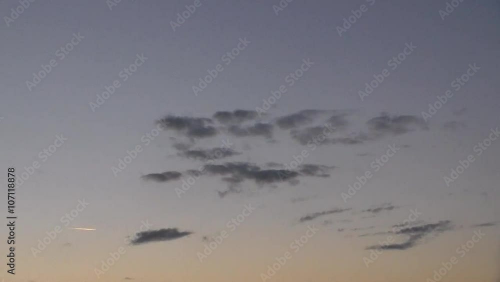 Gray clouds in evening sky with a inversion traces from an airplane. Accelerated video. Timelapse. No sound. Gray clouds in evening sky with a inversion traces from an airplane. Accelerated video. Timelapse. No sound.