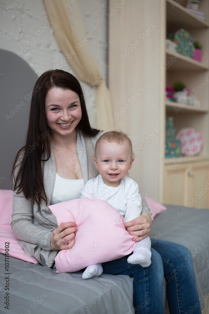 Funny playful mum with baby toddler at home Funny playful mum with baby toddler at home