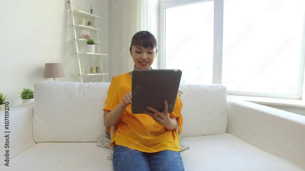 happy young asian woman with tablet pc at home happy young asian woman with tablet pc at home