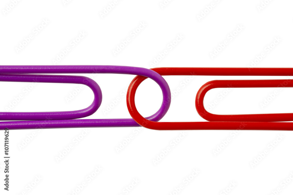 cropped image of two paper clips against white. cropped image of two paper clips against white.