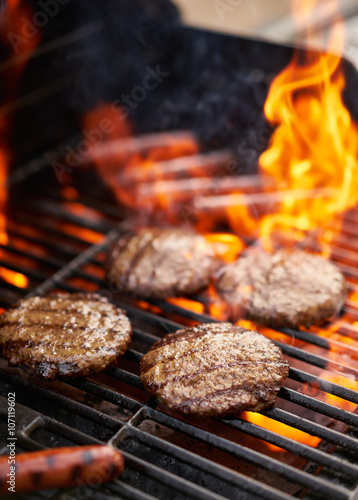 hamburgers and hot dogs being grilled