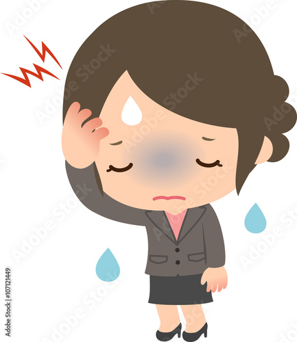 頭が痛くて困っているスーツの女性