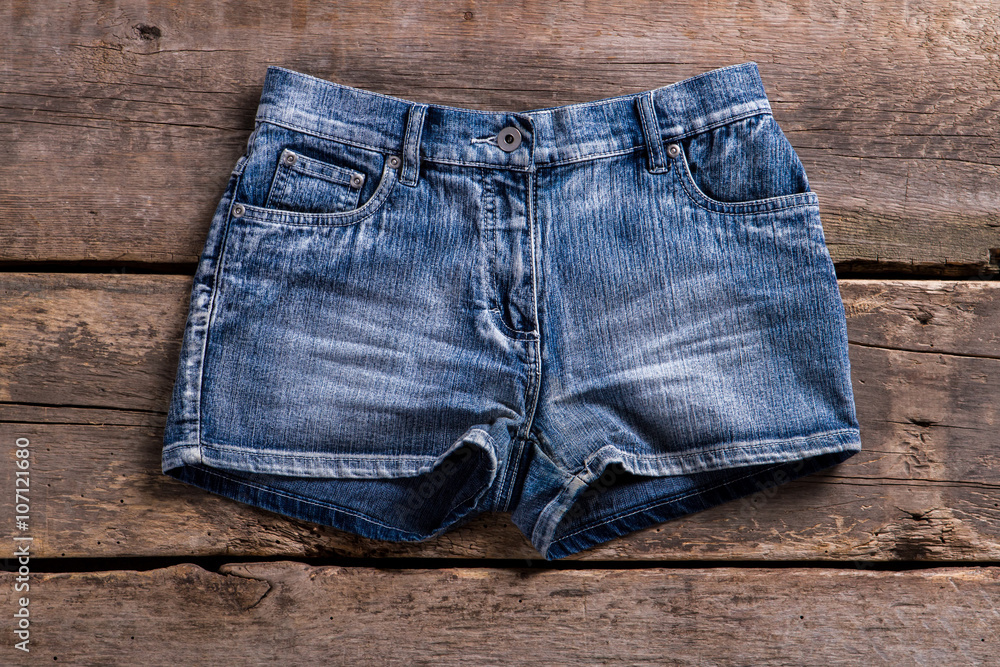 Denim shorts on aged shelf. Denim shorts on aged shelf.