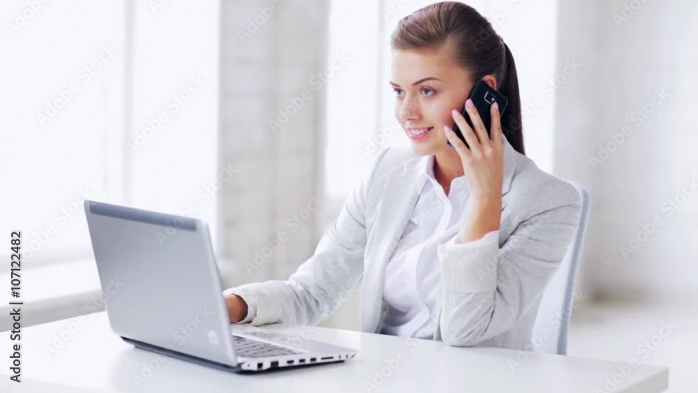 attractive office worker taking phone call
