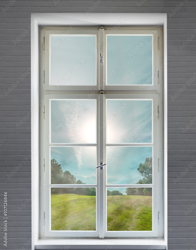 Classic white window on a brick wall and the forest view Classic white window on a brick wall and the forest view