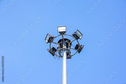 Electric light pole on blue sky