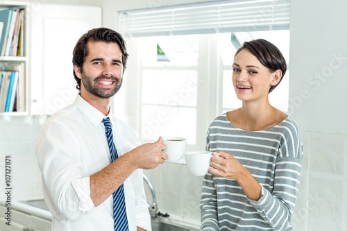 Portrait of businessman with woman enjoying coffee