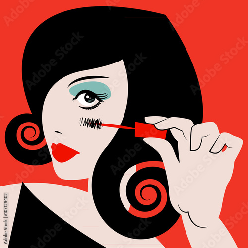 Woman applying mascara. Makeup.