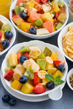 healthy breakfast with fruit salad, vertical, top view