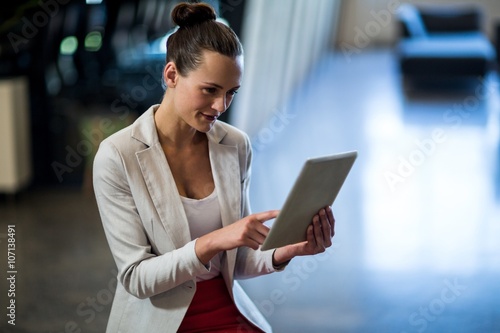 Beautiful businesswoman using digital tablet