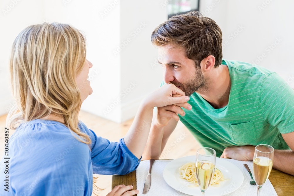 Man kissing a womans hand Man kissing a womans hand