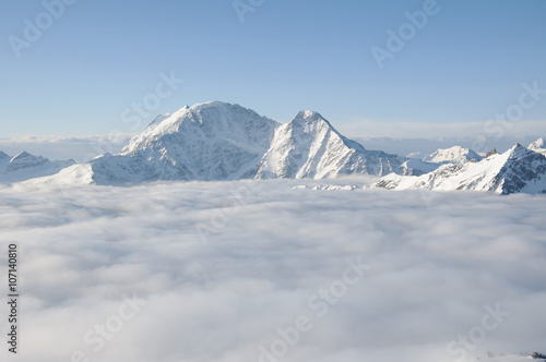 Mountain peak sticking out of the clouds © k1777