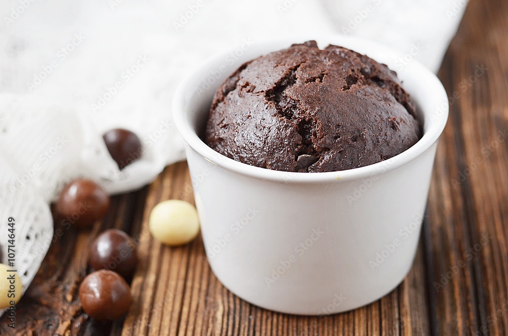 Chocolate muffin on a wooden table Chocolate muffin on a wooden table