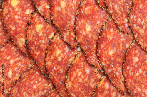 Black pepper-coated salami with cheese