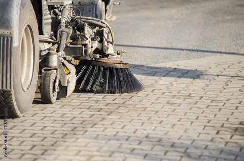 Street sweeper machine cleaning the street photo