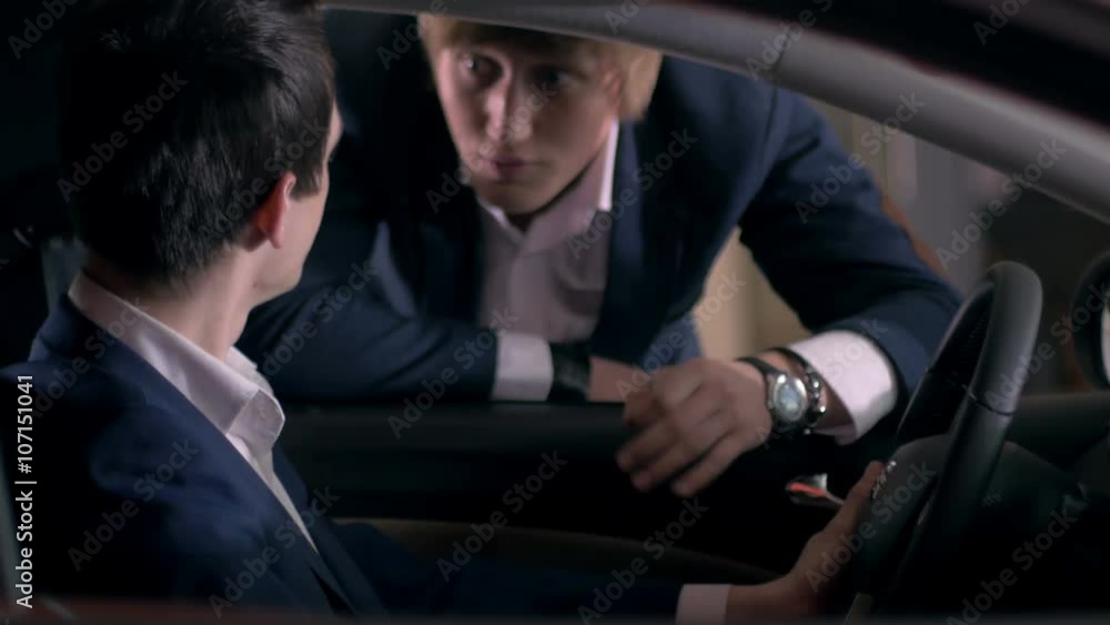 Customer inspecting car interior Customer inspecting car interior