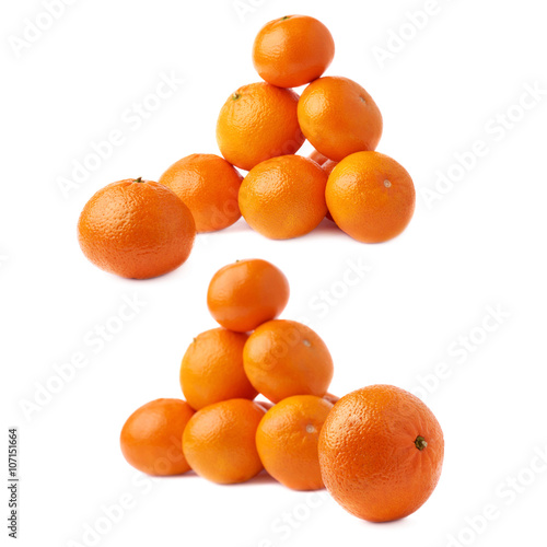 Pile of multiple ripe fresh juicy tangerines, isolated over the white background