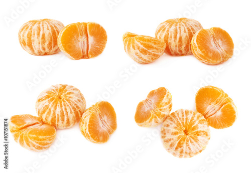 Two halves anh whole fresh juicy tangerine fruit isolated over the white background