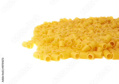 Pile of dry ditalini pasta over isolated white background