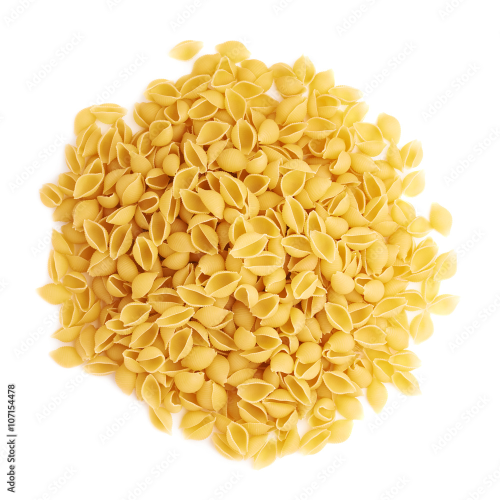 Pile of dry conchiglie pasta over isolated white background Pile of dry conchiglie pasta over isolated white background