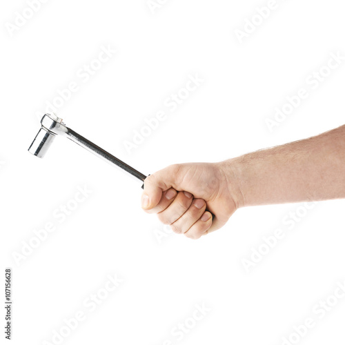 Hand holding a socket wrench tool, composition isolated over the white background