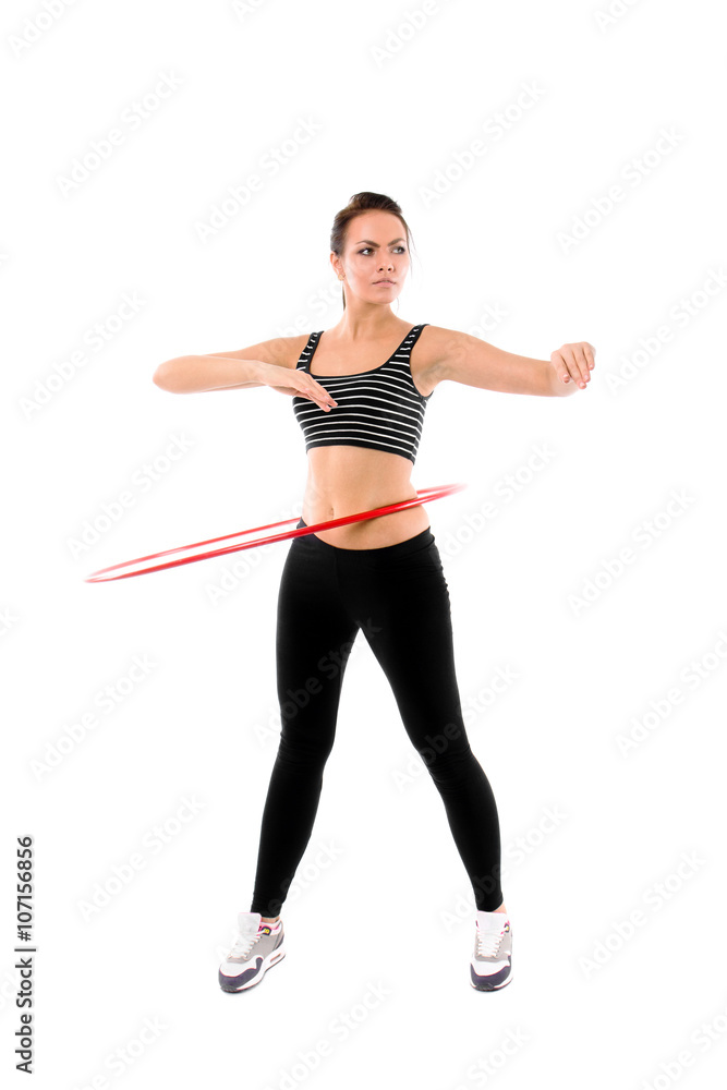 Woman training with hula hoop isolated on white Woman training with hula hoop isolated on white