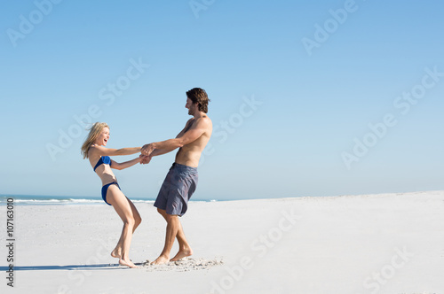 Couple playing at beach
