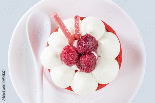 tartlet with cream and raspberries, view from above photo